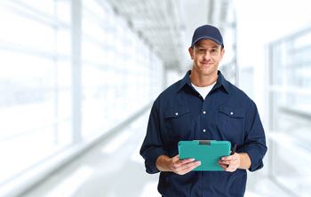 a man in a uniform holding a clipboard